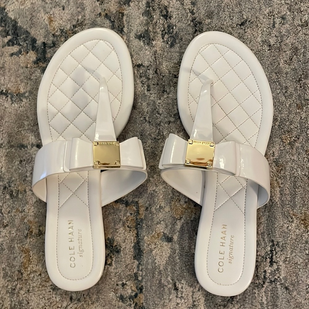 Cole Haan Signature white patent leather flat sandal. Size 7. With bow!